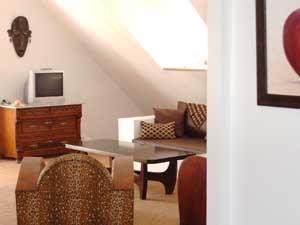 2 person extra large penthouse with mountain view, balcony, an extra bed, private facilities (bath and shower), and breakfast